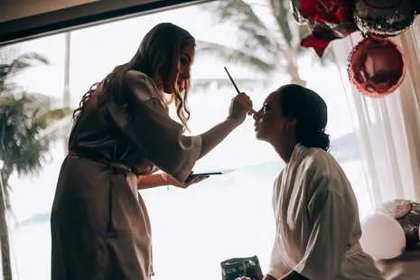 Bride getting ready in her room before walk down the aisle.